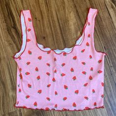 New Topshop Cropped Tank Is Pink With Red Lettuce Edges And A Strawberry Pattern. Size Small. Lightweight 97% Polyester 3% Elastane For Stretchy Comfortable Fit Approx 13.5” Pit To Pit Unstretched And 14.5” Shoulder To Hem Cute Strawberry Print Tops For Spring, Red Strawberry Print Top For Summer, Red Sleeveless Top With Strawberry Print, Sleeveless Red Top With Strawberry Print, Cute Fitted Tank Top For Spring, Fitted Casual Tops With Strawberry Print, Casual Fitted Strawberry Print Tops, Trendy Spring Tops With Strawberry Print, Fitted Cotton Top With Strawberry Print