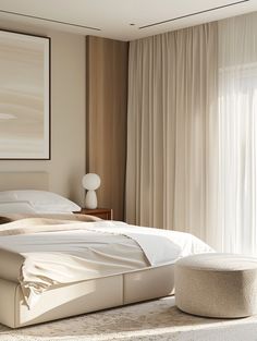 a large white bed sitting in a bedroom next to a window