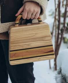 Welcome to my store! Wooden bag in the shape of a trapezoid. This is a unique, handmade wooden bag . This bag is carefully handcrafted, made entirely of natural strong wood, and has a beautiful chain or leather strap that is removable for those who want to carry this bag as a clutch. A very beautiful and original accessory. Made by hand from natural wood. Ash, apricot, mulberry, thermo wood An individual order is possible, taking into account your wishes. All fittings are silver, very good quality. Natural color. No dyes. Coating - water-based ECO varnish Italy SIZE: Bottom width 25 cm / 9,8 inches Upper width 20 cm / 7,8 inches Height 20 cm / 7,8 inches Thickness 7 cm / 2,7 inches Please contact me in case you have any questions about this item and I will try to reply as soon as possible. Wooden Bags Design, Custom Woodworking Projects, Wood Purse, Wood Bag, Wooden Purse, Workbench Plans Diy, Kitchen Tools Design, Wooden Bag, Wood Ash