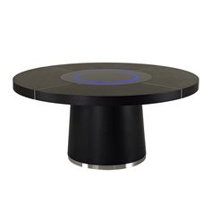 a black table with a blue circle on it's center and two silver circles at the top