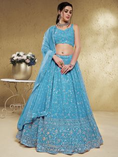 Make a stunning statement on any special occasion with our lovely sky-blue embroidered georgette engagement wear lehenga choli. This exquisite ensemble is crafted from high-quality georgette material in a beautiful sky-blue color. Designed with intricate sequin and embroidered work, this lehenga choli set is sure to turn heads and make a lasting impression.
One of the key benefits of this stunning lehenga choli is its versatility. Whether you're attending a wedding, ceremony, or reception, this Aqua Blue Lehenga, Sky Blue Lehenga, Georgette Material, Bridesmaid Lehenga, Lehenga Wedding, Blue Lehenga, Designer Lehenga Choli, Beautiful Sky, Wedding Wear