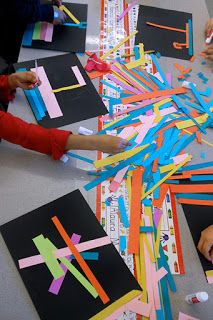 children making art with construction paper and scissors