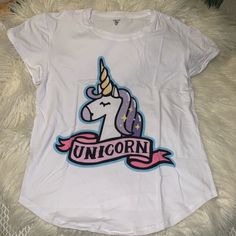 Unicornio Blouse New Never Used Fun Multicolor Tops With Unicorn Print, Fun Multicolor Unicorn Print Tops, White Unicorn Print Crew Neck Top, White Unicorn Print T-shirt For Summer, Summer Unicorn Print Crew Neck Top, Summer White T-shirt With Unicorn Print, Casual Multicolor Unicorn Print Top, Short Sleeve Unicorn Print Tops For Summer, Summer Crew Neck Top With Unicorn Print