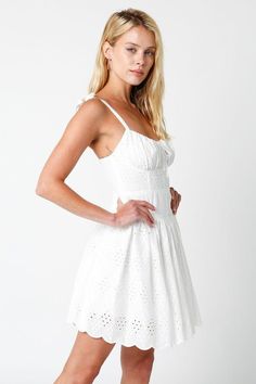 Live your fairytale in the Chateau White Eyelet Bustier Dress! Woven white fabric with an eyelet print throughout forms a bustier mini dress with self-tie straps, a fitted waist and fit, and a flare mini skirt. Features scalloped hem and back zipper/closure. Style with cute platform sandals for a cute summer look! Lined. DETAILS & FIT S: 30" length, 26" waist, 28" bust M: 31" length, 28" waist, 30" bust L: 32" length, 30" waist, 32" bust 100% Cotton. 100% Cotton Lining. Dry clean or hand wash co