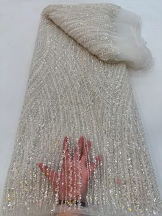 This high quality Fabric is measured in 5 Yards With Embroidered Beading and Sequin. It is soft, very delicate and beautiful. This high Quality Fabric is made with Fashion embroidered rhinestones can be used in making party wedding dresses, skirts, shawls, scarves and other other fashion apparels as you would like. Size : Length : 5 yards (180 inch). Width: 50 inch (Please allow slight deviation for the measurement data ,±1 inch) Material: 100% Polyester, Tulle Lace Fabric, Eco-Friendly embroide Fitted Embroidered Fabric With Rhinestones For Evening, Luxury Elegant Sparkling Embroidered Fabric, Fitted Embellished Embroidered Fabric For Banquet, Elegant Sparkling Tulle Fabric For Wedding, Elegant Embroidered Sequin Fabric For Banquet, Elegant Embellished Fitted Tulle Fabric, Elegant Rhinestone Embroidered Fabric For Banquet, Elegant Sequined Tulle Fabric For Banquet, Elegant White Sequin Fabric For Reception