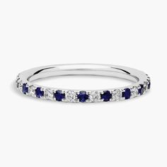 a white gold band with blue and white diamonds