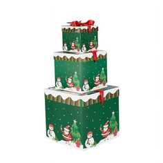 three stacked boxes with snowmen and christmas trees on the top one has a red bow