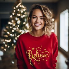 Believe Sweatshirt, Christmas T-shirt, Santa Gift Shirt, Christmas Lover T-shirt, Inspirational Shirt, Merry Christmas Gift T-shirt -----How To Order----- 1-) Please, check and review all photos 2-) Choose your t-shirt size and color *Different styles of shirts may have different shades of same color choice due to different manufacturer brands. *For this reason, we recommend you to match shirts from the same styles if you want precisely matching colors (exa. Unisex, V-neck, Tank top, etc.). 3-) Click add to cart. You can go back to add more product 4-)Click "Proceed to check out" 5-)When you check out, you can add a note to seller for any request. ---------- Product ---------- * 4.2 oz., 100% airlume combed and ringspun cotton, 32 singles. * Solid Colors:100% Airlume combed and ring-spun c Red Crew Neck Top For Gift, Festive Red Long Sleeve T-shirt, New Year Gift Crew Neck T-shirt, Festive Christmas Crew Neck T-shirt, Festive Crew Neck T-shirt For New Year, Red Letter Print Top For New Year, Red Long Sleeve T-shirt Gift, Festive Crew Neck T-shirt With Letter Print, Festive Letter Print Crew Neck T-shirt