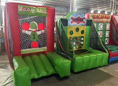 several inflatable games are lined up on the floor