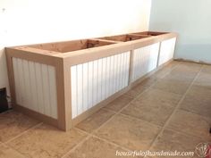 an unfinished kitchen counter in the middle of a room with tile flooring and white walls