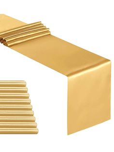 a gold table runner is shown with several rows of folded napkins in front of it