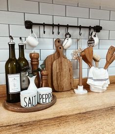 kitchen utensils and wooden cutting boards on a counter