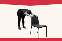 a woman bending over to look at a chair