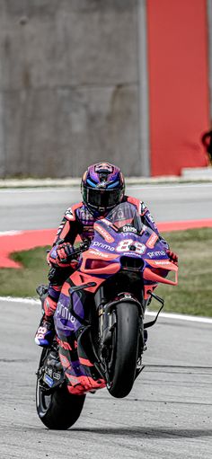 a person riding a motorcycle on a race track