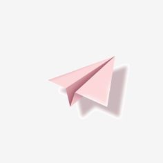 a pink paper airplane flying through the air