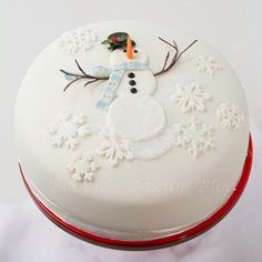 there is a cake decorated like a snowman