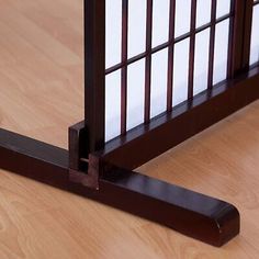 a close up of a wooden bed frame on the floor