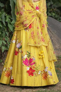 Yellow lehenga with wildflower embroidered motifs and sequin stripes. Paired with embroidered crop top and embroidered sheer dupatta.
Component: 3
Pattern: Embroidered
Type Of Work: Wildflower
Neckline: Leaf
Sleeve Type: Sleeveless
Fabric: Raw Silk, Georgette 
Color: Yellow
Other Details: 
Embroidered blouse
Tassel dupatta
Occasion: Destination Wedding - Aza Fashions Tassel Dupatta, Sheer Dupatta, Leaf Sleeve, Yellow Lehenga, Embroidered Motifs, Embroidered Crop Tops, Fashion App, Bridal Lehenga, Embroidered Silk