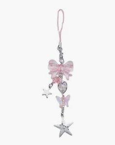 a pink and silver key chain with charms