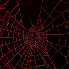 the inside of a spider web with red light