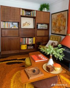 a living room filled with furniture and bookshelves