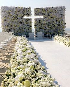 a row of white chairs sitting next to each other