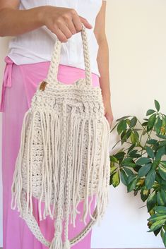 Boho fringe handbag. White Bohemian Bucket Bag For Everyday, Everyday White Bohemian Bucket Bag, Bohemian Bucket Tote Bag With Tassels, Bohemian Tote Bucket Bag With Tassels, Bohemian Bucket Bag Tote With Tassels, Bohemian Beige Bucket Hobo Bag, White Bohemian Bucket Bag, Bohemian Handwoven Everyday Bucket Bag, Everyday Bohemian Handwoven Bucket Bag