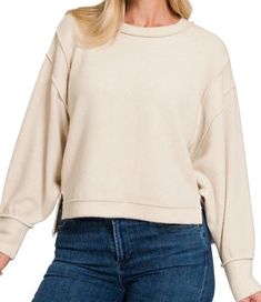 A cozy and stylish addition to your wardrobe that offers both comfort and a trendy look. This sweater features a brushed melange hacci fabric, known for its soft and textured feel, combined with an oversized silhouette exposed-seam sweater with side slits, exposed seam details, hi-low hem, Cozy Soft-washed Sweater For Spring, Cozy Soft Texture Sweatshirt For Spring, Beige Cozy Tops, Beige Cozy Fit Top, Cozy Beige Tops, Casual Long Sleeve Soft Tops, Soft Casual Fall Tops, Comfy Soft Texture Tops For Spring, Soft Casual Tops For Fall