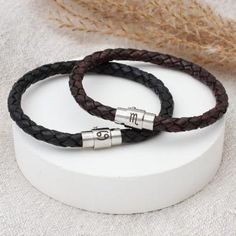 This stylish bracelet is engraved with your choice of zodiac symbol to create a beautiful gift that will be treasured for years to come. Stylish and robust, this bracelet is made from treated, hard wearing plaited leather and finished with a strong magnetic twist and lock clasp. We engrave our pieces to create bespoke items especially for you, we are always happy to try and help if something is unsuitable but we regret we are unable to offer refunds on personalised items. Personalized Leather Bracelet, Stylish Bracelet, Zodiac Symbols, Men's Bracelet, Mens Leather Bracelet, Gift Pouch