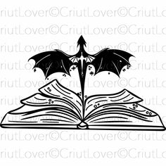 an open book with a bat flying over it