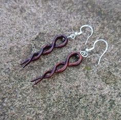 Exquisitely delicate handmade pair of Celtic knot Earrings made from reclaimed Rosewood that has been recycled from a Snooker Table leg rescued from a Skip! Because of the dense grain in Rosewood even being so delicate they are not fragile and are intended to be worn. The photos show you the shape,style and colour but cannot convey how light and well balanced they feel when worn or held. They measure 5cm, are hung on Sterling Silver hooks finished with a organic Beeswax polish and are delivered Snooker Table, Celtic Knot Earrings, Beeswax Polish, Celtic Earrings, Table Leg, Knot Earrings, Celtic Knot, Jewelry Earrings Dangle, Handmade Items