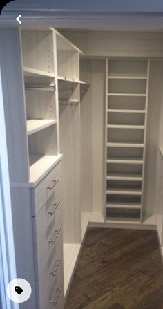 an empty walk in closet with shelves and drawers