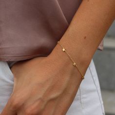 This beautiful silver Stars bracelet has an extender chain as adjusts to fit different wrist sizes. The length can go from 15 to 18cm. This dainty bracelet looks gorgeous stacked with other bracelets and watch. Simple, delicate and versatile... you'll want in your collection. D E T A I L S * Available in sterling silver or Crafted in Gold plated 925 sterling silver * Very easy to put on * An extender chain means it adjusts to fit different wrist sizes. - we use only the finest quality materials Dainty Adjustable Chain Bracelet With Star Charm, Adjustable Dainty Star Jewelry, Adjustable Delicate Jewelry With Star Charm, Everyday Star Charm Bracelet, Dainty Sterling Silver Bracelet With Star Charm, Gift Chain Bracelet With Star Charm, Elegant Everyday Bracelets With Star Charm, Dainty Star-shaped Bracelets For Everyday Wear, Dainty Star Charm Bracelet