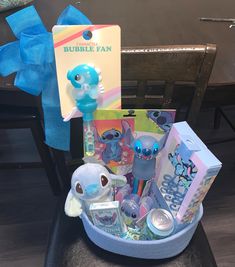 a blue basket filled with toys on top of a table