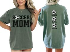 Celebrate your favorite soccer players with our custom soccer mom shirt, personalized with the players names and numbers on back. With short sleeves and a classic crewneck, this shirt makes the perfect gift for the soccer mom or mama who loves to show her support on game day at the soccer fields, making her feel like a varsity soccer super fan. COMFORT COLORS 1717 SHIRT: Unisex 100% US cotton - ethically grown and harvested Pre-Shrunk Fabric Relaxed Fit - Size up for a trendy oversized look Seam Personalized Short Sleeve Tops For Sports Events, Sporty Personalized Short Sleeve Top, Personalized Crew Neck T-shirt For Fans, Personalized Crew Neck Tops For Fan Merchandise, Personalized Sporty Tops For Sports, Sporty Personalized Tops For Sports Events, Personalized Crew Neck Sports Top, Sporty Personalized T-shirt For Sports Events, Personalized Fan Merchandise Crew Neck T-shirt