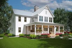 a large white house sitting on top of a lush green field