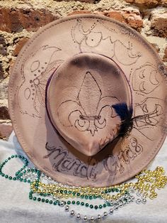 These custom burned women's hats are so much fun to make! You can have one created specifically for you, or you can order one of these hats listed as is or add something to it if you like! I've got to say though, out of all the hats I've created, this Mardi Gras one is my fav so far!! Whether it be a quote or sunflowers burned onto the brim, a specific colored band around the hat, with a feather in it or whatever you can dream up, this hat will be created with love! You can tell us in the person Customizable Brown Hat With Flat Brim, Customizable Brown Flat Brim Hat, Custom Curved Brim Festival Costume Hat, Custom Curved Brim Costume Hat For Festivals, Custom Festival Costume Hat With Curved Brim, Custom Costume Hat With Curved Brim For Festivals, Custom Festival Costume Hats With Flat Brim, Custom Flat Brim Festival Costume Hat, Customizable Flat Brim Hat With Adjustable Fit