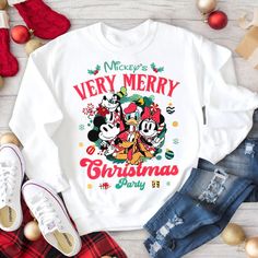 Mickey's Very Merry Christmas Sweatshirt, Mickey And Friends Christmas Shirt, Magic Kingdom Family Xmas Matching Tee, Christmas Gift Shirt LS5650 Thank you for choosing our store! My goal is to provide you with a pleasant shopping experience, and I am always available to assist you. If you have any special requests or questions, please do not hesitate to message me, and I will respond as soon as possible. Here is some helpful information to guide you: HOW TO ORDER: Select your desired color and Mickey And Friends Christmas, Very Merry Christmas Party, Friends Christmas, Matching Tees, Friend Christmas, Very Merry Christmas, Disney Outfits, Mickey And Friends, Magic Kingdom