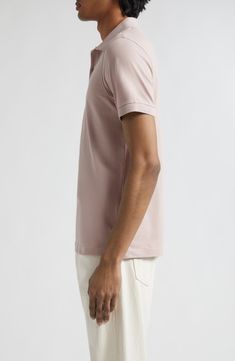 The renowned British label has perfected the polo with this cotton piqué version designed for durability and softness. 27 1/2" length (size Medium) Button half placket Rib collar Short sleeves with rib cuffs 100% cotton Machine wash, dry flat Made in Portugal Designer Clothing Cotton Polo Sweater With Button Closure, Classic Pink Collared Polo Shirt, Classic Pink Polo Shirt, Classic Relaxed Fit Polo Shirt With Ribbed Collar, Classic Relaxed Fit Polo Shirt With Polo Collar, Classic Relaxed Fit Polo Shirt, Classic Cotton Polo Sweater, Collared Cotton Polo Sweater, Classic Relaxed Fit Polo Shirt With Seamless Collar