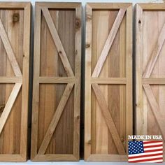 three wooden doors with american flag stickers on them