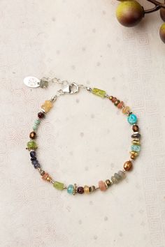 Infuse your wardrobe with the vibrant hues and endless possibilities of the Thrive Collection. This stunning piece boasts a colorful and versatile design that will elevate any outfit. Sterling Silver (lead and nickel free) Citrine, Iolite, Blue Apatite, Peridot, Labradorite, Garnet, Freshwater Pearl, Turquoise 7.25-8.25", adjustable with sterling silver lobster claw clasp We hand select our natural materials, thus there may be slight variations in color and/or size that will not detract from the Floyd Va, Silver Gold Earrings, Silver Gold Necklace, Pearl Design, Blue Apatite, Gold Collection, Beaded Jewelry Patterns, Designer Jewelry, Beads And Wire