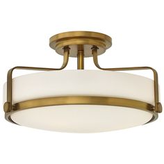 a semi - flush ceiling light with white glass in an antique brass finish and frosted opal shades