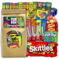 an assortment of candy and snacks in a bag with the words skittles on it