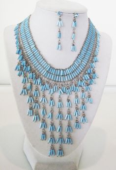 ICON BLUE CRYSTAL GLASS  BEAD CHEVRON HANDMADE NECKLACE  EARRINGS JEWELRY SET NEW Up for your consideration is a delightful chevron necklace and earrings beaded jewelry set. Powerful look lightweight BIG IMPACT easy to drape along the neckline.  Necklace is 12in with a 3in extender Earrings 2in X 1/4in pierced  Center Station is  8 1/2 W X 4 1/2 L drop silver-tone metal with a lobster claw clasp. please e-mail if you nee a larger quantity! Diy Beaded Bracelets, Chevron Necklace, Earrings Beaded, Wrapped Jewelry, Handmade Necklace, Acrylic Beads, Blue Crystals, Diy Beads, Wire Wrapped Jewelry