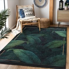 a green rug with leaves on it in a living room