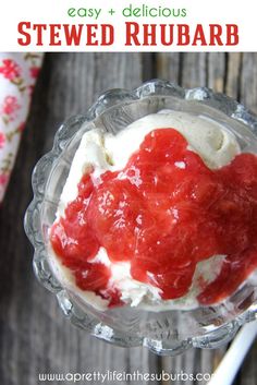 a dessert in a glass bowl with whipped cream and strawberry toppings on the top