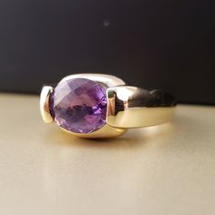 "\"Previously Loved, Not New\" Vintage Amethyst Ring, Featuring a Genuine Amethyst center (*Price of the ring is really gold only. The center is pretty scratched on the surface.*) This Genuine Purple Amethyst center stone is a checkered board cut oval shape. 14k Yellow Gold setting with 2 heavy bars. **Ring size: 6.25 **Amethyst is February's Birthstone, AND 2018 color of the year. This item can be sized up or down 2 sizes for an additional $30.00 Please feel free to contact me anytime, if you h Luxury 14k Gold Purple Rings, Luxury Purple 14k Gold Rings, Fine Jewelry 14k Gold Amethyst Ring With Round Cut, Timeless Purple Rings Perfect For Gifts, Formal 14k Gold Amethyst Ring, Timeless Purple Rings As Gifts, Timeless Purple Rings For Gifts, Classic Amethyst Ring Stamped 14k, Oval Amethyst Ring Stamped 14k