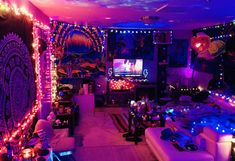 a living room filled with lots of furniture and lights on the ceiling, all lit up