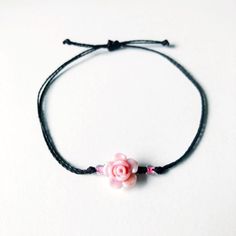 This rosette wax cord bracelet is the perfect gift for the floral lover in your life. Simple and cute rose jewelry goes with every outfit!  Choose between 8 different roses, and over 50 different thread colors! Completely waterproof, adjustable so it will fit any size wrist. Just pull to close. All of my friendship bracelets are made with 100% cotton embroidery floss & my water proof jewelry is made with 100% waxed polyester cord. Any other supplies I use are all natural & eco friendly & everyth Pink Braided Bracelet With Adjustable Cord As Gift, Pink Adjustable Cord Friendship Bracelet As Gift, Flower Shaped Jewelry With Adjustable Cord As A Gift, Flower-shaped Jewelry With Adjustable Cord For Gifts, Adjustable Pink Flower Friendship Bracelets, Adjustable Rose Gold Bracelet With Flower Charm, Adjustable Rose Gold Flower Beaded Bracelets, Pink Adjustable Flower Friendship Bracelets, Adjustable Dainty Rose Jewelry