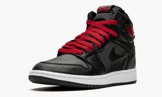 The Air Jordan 1 GS “Black Satin” is the youth sizing of lifestyle-focused high-top featuring a premium finish applied to its upper.  Now firmly entrenched as one of streetwear’s most essential styles, the high-top Jordan 1 is more at home on the streets than the courts these days, and the materials used on this colorway speak to that sentiment.  A black satin material is applied to the toe, mid-panel and collar.  Black leather overlays appear on the forefoot, toe cap, collar and heel.  Tonal si High Top Jordans, Air Jordan 1 High, Kids Jordans, Jordan 1 High, Air Jordan 1 Retro, Satin Material, Jordan 1 Retro High, Jordan 1 Retro, Red Shoes